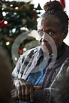 A black elderly woman in Chrismas holiday