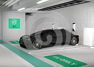 Black electric car charging in charging station locate in underground  parking lot