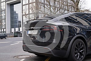 black electric car tesla, Model X on street, popular Elektro-SUV from company Elon Musk, alternative energy development, clean