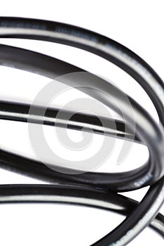Black electric computer cable isolated over white background