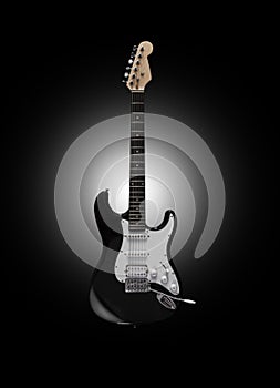 Black electric guitar on black background