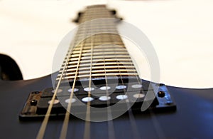 Black electric guitar isolated on the white backgriund