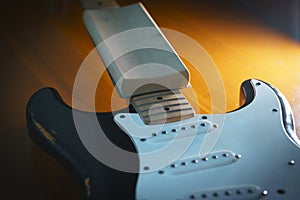Black electric guitar maintenance fret leveling