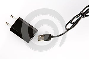 Black electrical adapter to USB port on a white background