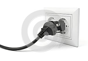 Black electrical plug inserted into a white wall socket