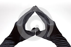 Black elegant women's heart shaped gloves isolated on white background