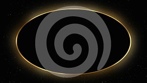 Black ellipse with golden edging on black background with flying particles. Animation of a deluxe frame for text and