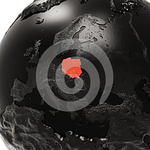 Black Embossed Earth Globe with Europe Close-Up. The Republic of Poland is Highlighted in Red in The Center.