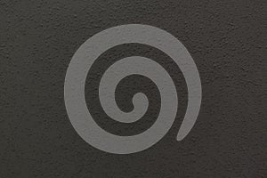 Black embossed plastic surface. Abstract background or texture.