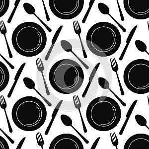 Black empty plate with spoon, knife and fork seamless pattern isolated on a white background.