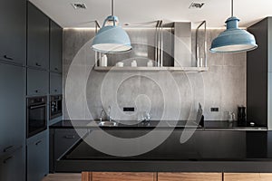 Black empty table in modern kitchen interior