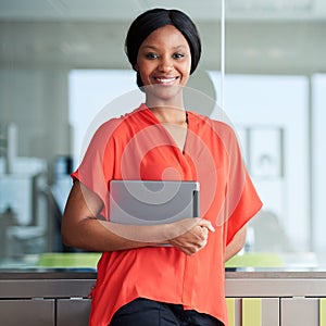 Black entrepreneur smiling at camera while standing in business lounge
