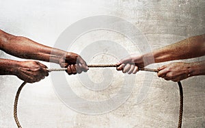 Black ethnicity arms with hands pulling rope against white Caucasian race person in stop racism and xenophobia concept