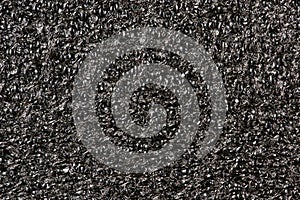 Black Expanded polyethylene foam solid color background.