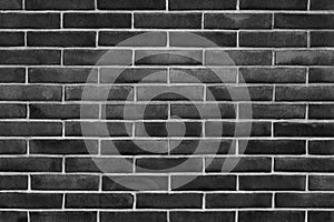Black exposed brick wall background texture without plaster - concept image