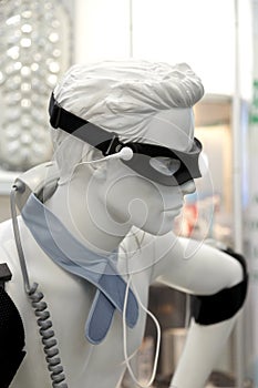 Black eye patch, medical sensors and equipment on the mannequin. Modern treatment technologies