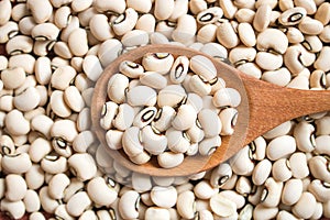 Black eyed beans in wooden  spoon