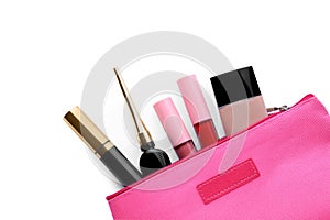 Black eyeliner and other makeup products in cosmetic bag on white background, top view