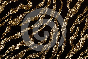 Black fabric with golden sequin pattern photo