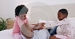 Black family, bedroom and children tickling their father in the morning at their home together for fun. Love, smile and