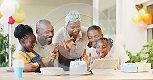 Black family, birthday cake and candles for children to celebrate with parents at a table. African woman, men and happy