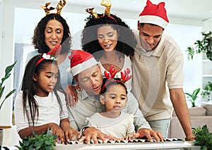 Black family, christmas singing and together at piano for learning, festive celebration or bonding. Father, teaching and