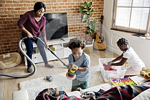 Black family cleaning the house together