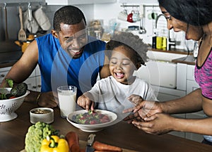 Black family eating healthy food together