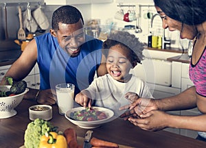 Black family eating healthy food together