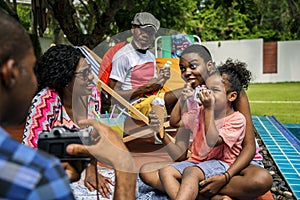 Black family enjoying summer together at backyard