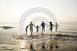 Black family having fun on the beach