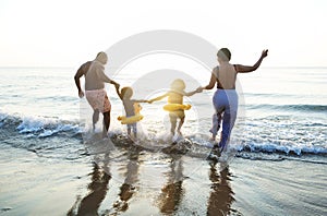 Black family having fun on the beach photo
