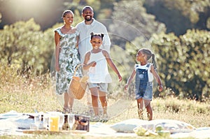 Black family, summer picnic and children bond with parents on break in remote countryside park field. Smile, happy and