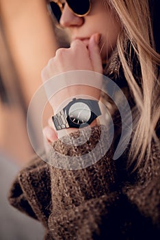 Black fashion watch on woman hand