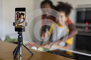 Black Father And Daughter Filming Content In Kitchen For Their Culinary Vlog