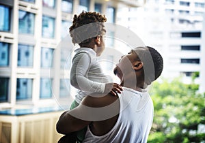 Black father enjoy precious time with his child together happiness