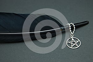 Black feather quill and pentacle necklace