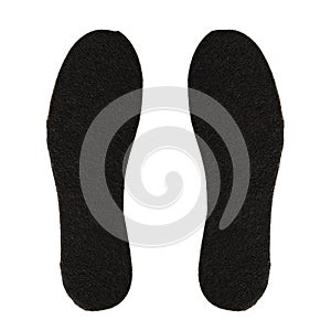 Black felt insoles isolated on white background