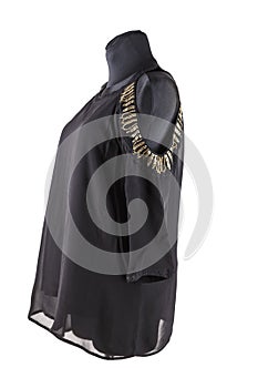 black female blouse or tunic with embroidery on the shoulders on the mannequin.