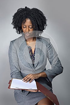 Black Female Business Woman with Contracts or Reports