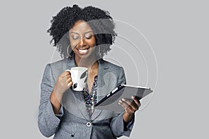 Black Female Businesswoman Keynote Speaker Posing with a Tablet and Coffee