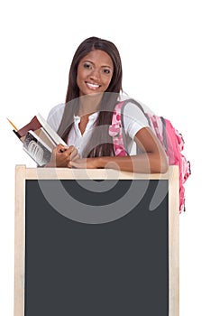 Black female College student by blackboard