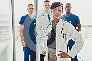Black female doctor leading medical team photo