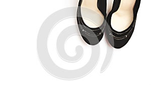 Black female high heel shoes isolated on white background. Flat lay, top view