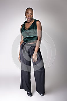 Black Female Model With Bald Hairstyle and Green Clothing