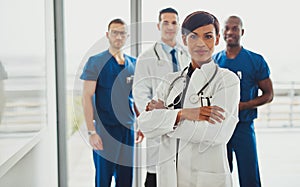 Black female standing in front of team