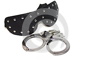 Black fetish mask and handcuff