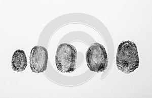 Black fingerprints on white background photo