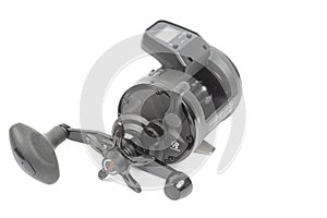 Black fishing reel baitcast isolated above white background