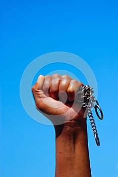 Black fist with chain